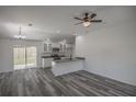 Modern kitchen featuring white shaker cabinets, stainless steel appliances, and gray countertops at 13099 Ne 7 Loop, Silver Springs, FL 34488