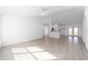 Spacious living room featuring light tile flooring and an open concept design at 200 Oak Lane Run, Ocala, FL 34472