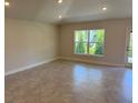 Inviting living room with tile flooring, natural light, neutral paint, and a sliding glass door at 2158 Nw 23Rd Loop, Ocala, FL 34475