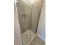 Modern shower with glass enclosure featuring a built-in niche, and tiled walls at 2162 Nw 23Rd Loop, Ocala, FL 34475
