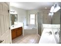 Main bathroom with double vanity, soaking tub and shower at 21962 Sw Nautilus Blvd, Dunnellon, FL 34431