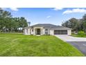 House exterior showcasing a classic design and well-maintained landscaping at 2883 Sw 66Th St, Ocala, FL 34476