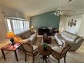 Bright living room with vaulted ceilings, neutral color palette, and ample natural light at 5242 Sw 162Nd Place Rd, Ocala, FL 34473