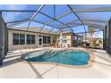 Inviting pool area with covered patio and lush landscaping at 6839 Sw 97Th Terrace Rd, Ocala, FL 34481