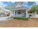 Front view of a charming house with a covered porch at 8540 Sw 90Th Pl # B, Ocala, FL 34481