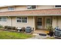 Inviting townhome featuring well-kept lawn and access to front entrance at 11001 Se Sunset Harbor Rd # E 33, Summerfield, FL 34491