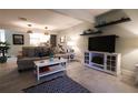 Comfortable living room with sleek decor, plush seating, and natural light at 11001 Se Sunset Harbor Rd # E 33, Summerfield, FL 34491