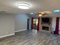 Living room with fireplace, vaulted ceiling and lots of natural light at 1936 Se 37Th Court Cir, Ocala, FL 34471