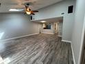 Spacious living room with vaulted ceilings, wood-look floors, and natural light at 1936 Se 37Th Court Cir, Ocala, FL 34471