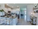 Modern kitchen with granite countertops and stainless steel appliances at 4062 Nw 44Th Cir, Ocala, FL 34482