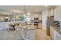 Open concept kitchen with granite countertops and stainless steel appliances at 4742 Nw 39Th Street Rd, Ocala, FL 34482