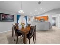 Dining room features a wood table and chairs, near kitchen at 6 Bahia Course Way, Ocala, FL 34472