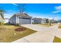 A street view showcasing well-maintained lawns and sidewalks in a residential neighborhood at 6411 Sw 78Th Avenue Rd, Ocala, FL 34474