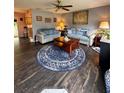 Spacious living room featuring two sofas and wood-look floors at 7632 Sw 112Th Ln, Ocala, FL 34476
