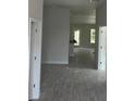 Bright hallway with wood-look tile floors leading to other rooms at 7661 Sw 180Th Cir, Dunnellon, FL 34432