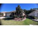 Curb appeal with manicured lawn and attractive landscaping around the home at 7729 Sw 85Th Cir, Ocala, FL 34481