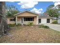 Cute ranch home with carport and mature landscaping at 8111 Sw 108Th Street Rd, Ocala, FL 34481