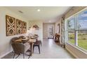 Casual dining area with wood table and modern decor at 8666 Sw 44Th Ter, Ocala, FL 34476
