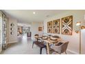 Bright dining area, wood table, and view into kitchen at 8666 Sw 44Th Ter, Ocala, FL 34476