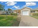 Ranch style home with attached garage and landscaped yard at 8677 Sw 95Th Ln # C, Ocala, FL 34481