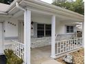 Covered porch with white columns and railings at 8707 Sw 88Th Court Rd # B, Ocala, FL 34481