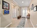 Bright entryway with tile flooring and access to other rooms at 9958 Sw 97Th Ln, Ocala, FL 34481