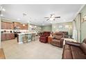 Open kitchen with island and stainless steel appliances at 9958 Sw 97Th Ln, Ocala, FL 34481
