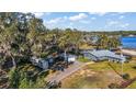 Large lot with house, multiple outbuildings, and lake access at 10455 Se 143Rd St, Summerfield, FL 34491