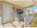 Inviting front porch with rocking chairs, perfect for relaxing at 11250 Sw 79Th Ter, Ocala, FL 34476