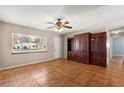 Spacious living room with built-in shelving and tile floors at 11250 Sw 79Th Ter, Ocala, FL 34476