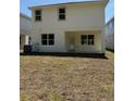 Backyard features a covered patio and ample space at 2214 Nw 23Rd Loop, Ocala, FL 34475