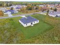 Aerial view of a house and surrounding neighborhood at 393 Marion Oaks Golf Rd, Ocala, FL 34473