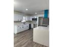 Modern kitchen featuring white cabinets, quartz countertops, and stainless steel appliances at 5921 Se 4Th Pl, Ocala, FL 34472