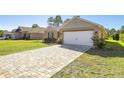 Two-car garage and paver driveway at 6836 Sw 179Th Court Rd, Dunnellon, FL 34432