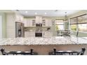 Modern kitchen featuring granite countertops and stainless steel appliances at 1065 Ne 31St Ter, Ocala, FL 34470