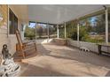 Relaxing screened porch with rocking chairs, offering a peaceful outdoor space at 20635 Sw 63Rd Pl, Dunnellon, FL 34431