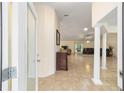 Bright entryway with view into living room and high ceilings at 21590 Sw 84Th Loop, Dunnellon, FL 34431