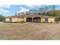 One story home with a large yard and screened porch at 21590 Sw 84Th Loop, Dunnellon, FL 34431