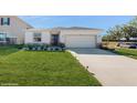 Front view of a single-story house with a two-car garage at 4388 Sw 56Th Pl, Ocala, FL 34474