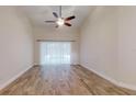 Spacious living room featuring hardwood floors and access to a pool view at 4475 Se 48Th Place Rd, Ocala, FL 34480