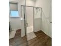 Modern walk-in shower with glass enclosure and neutral tile at 7208 Sw 61St Sw Pl, Ocala, FL 34474