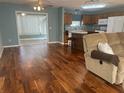 Spacious living room with hardwood floors and an open floor plan at 9581 Se 168Th Elderberry Pl, The Villages, FL 32162