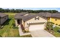 Single-story house with tan siding and a gray roof at 9661 Sw 63Rd Loop, Ocala, FL 34481