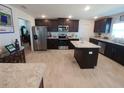 Modern kitchen with island and stainless steel appliances at 9727 Sw 125Th Court Rd, Dunnellon, FL 34432