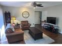Living room with dark hardwood floors and leather furniture at 1701 Se 24Th Rd # 201, Ocala, FL 34471