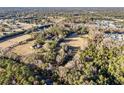 Aerial view showing house, expansive lot, and surrounding land at 2821 Se 80Th St, Ocala, FL 34480