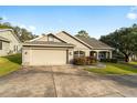 Single-story home with attached garage and landscaped yard at 4480 Nw 79Th Terrace Rd, Ocala, FL 34482