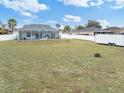 Large, expansive backyard with a screened-in pool, perfect for outdoor entertaining at 4880 Sw 106Th St, Ocala, FL 34476