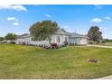 Side view of house showcasing landscaping and lawn at 5908 Nw 24Th St, Ocala, FL 34482