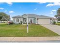 Well-maintained house with a lush lawn and attractive curb appeal at 5908 Nw 24Th St, Ocala, FL 34482